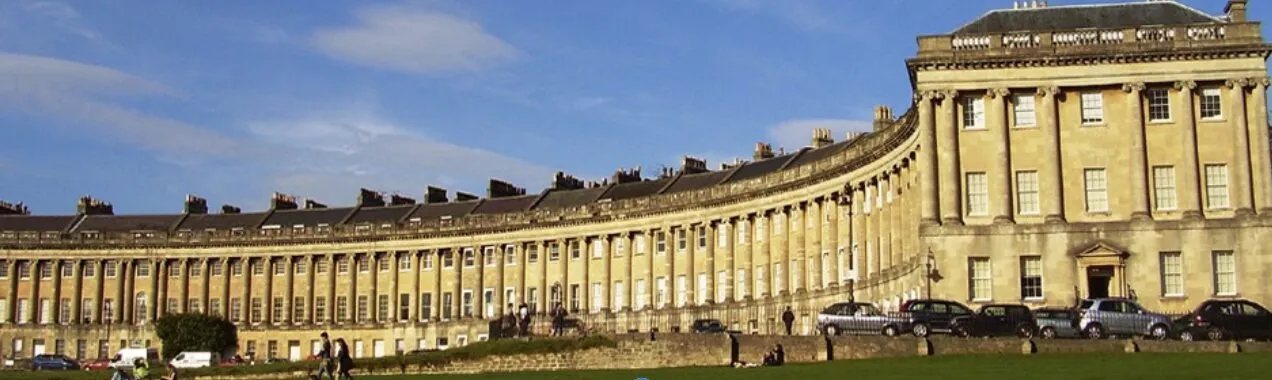 The Royal Crescent in Bath, a long curve of Georgian townhouses faced in golden Bath stone